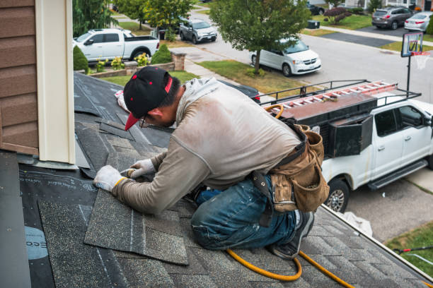 Professional Roof Replacement technician working in Strausstown, PA